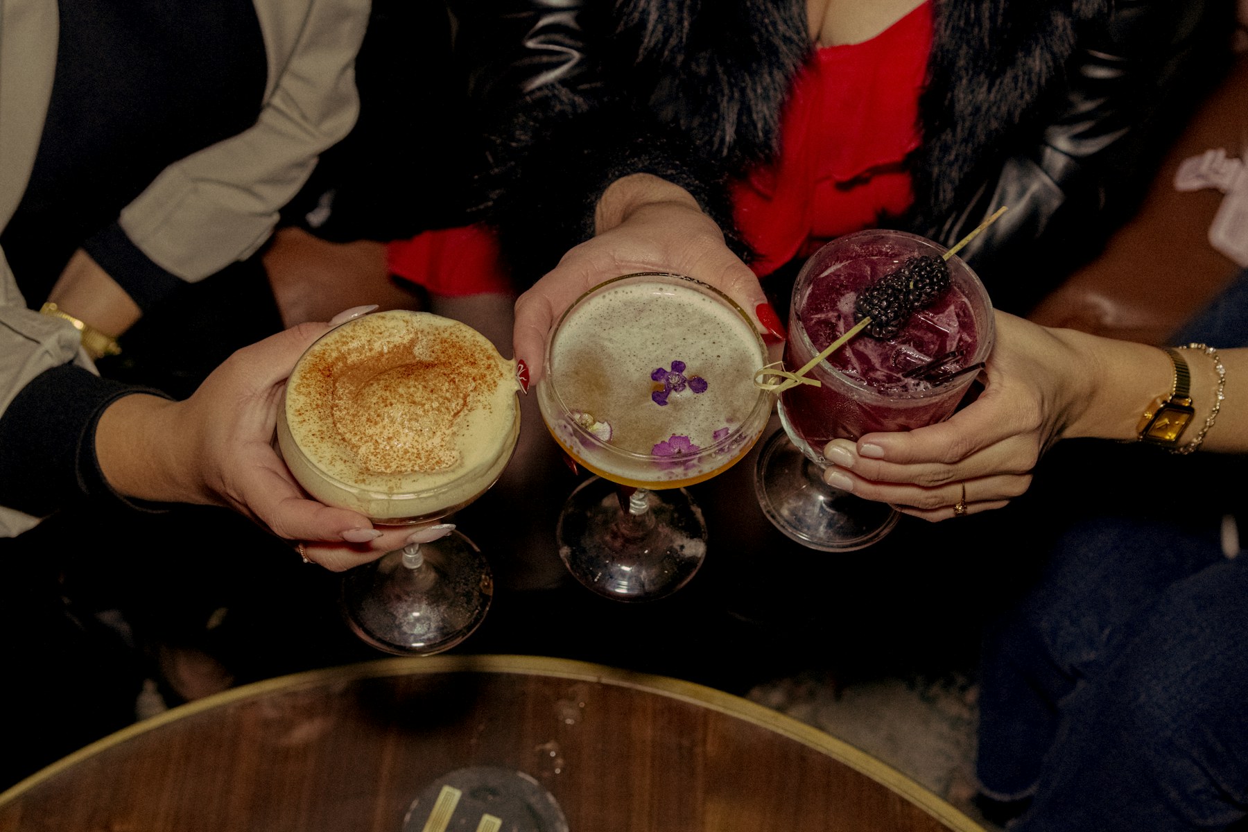 Guests toasting a special occasion with cocktails